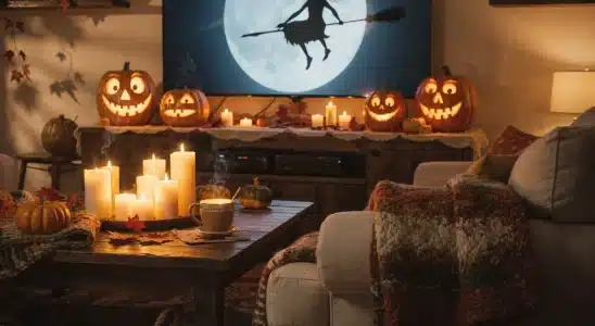 Cozy living room setup for streaming witchy Halloween movies with pumpkins and candles